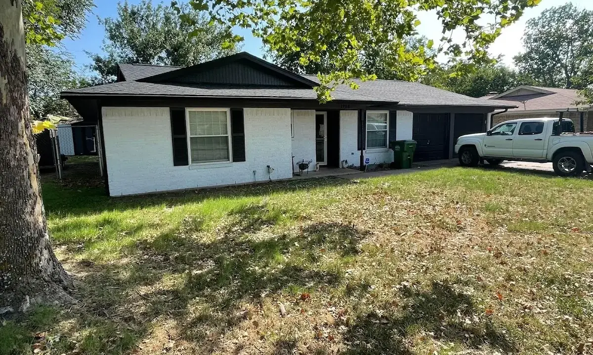 Professional roofing crew working on a residential roof in Waconia